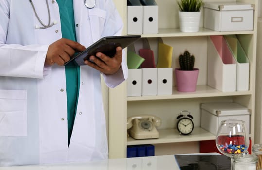 Doctor working on a digital tablet