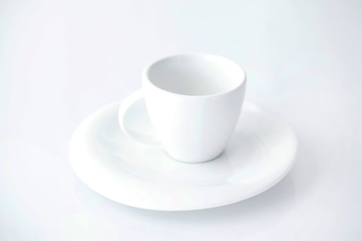 white cup with saucer 