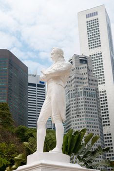 Sir Raffles statue with modern skyscrapers on background, Singapore