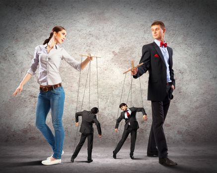 Image of man and woman with marionette puppets