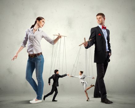 Image of man and woman with marionette puppets