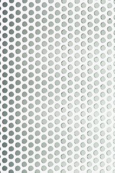 Seamless vector wallpaper of perforated metal grid texture