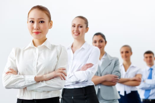 Group of businesspeople smiling standing with arms crossed