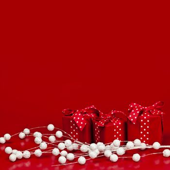 Red Christmas background with wrapped presents and decorations