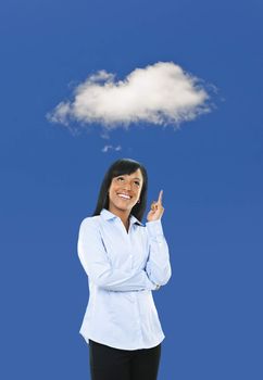 Smiling black woman thinking about cloud computing