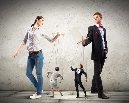 Image of man and woman with marionette puppets