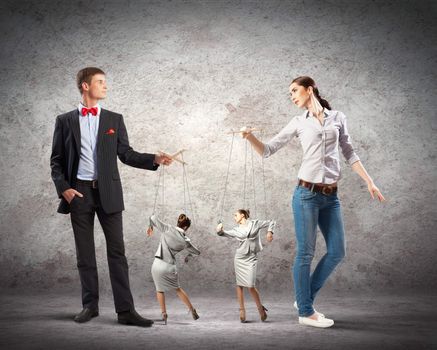 Image of man and woman with marionette puppets