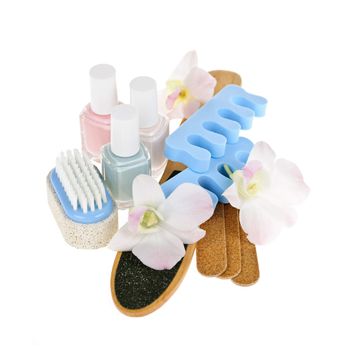 Pedicure accessories with nail polish on white background
