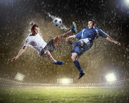 Image of two football players at stadium