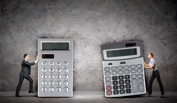 Image of two businesspeople with big calculators