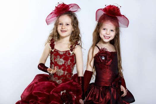 Portrait of two little girls in beautiful dresses