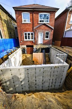 Building addition to residential house with new foundation
