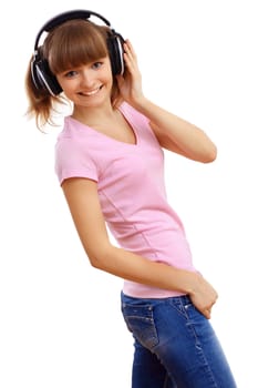 Happy smiling girl dancing and listening to music