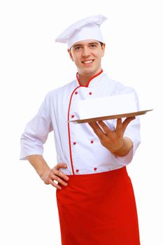 Male cook in uniform holding an empty tray