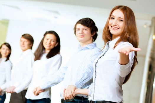 Image of five students in casual wear standing in row