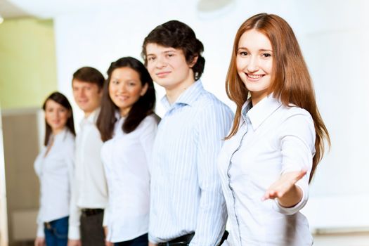 Image of five students in casual wear standing in row