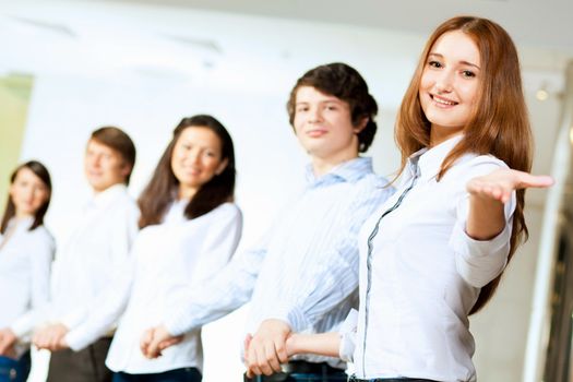 Image of five students in casual wear standing in row