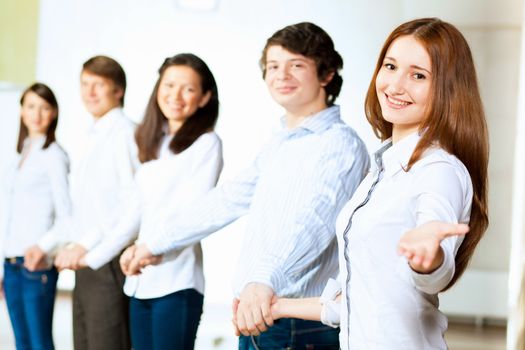 Image of five students in casual wear standing in row