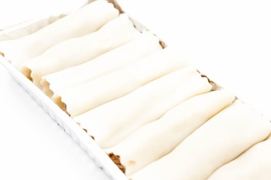 cannelloni in tray on a white background