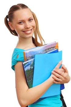 Happy smiling student standing and holding books