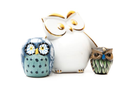 statues of owls on a white background