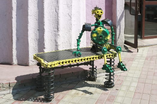 The sculpture is made out of car parts