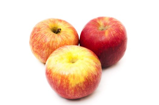 red and yellow apples on a white background 