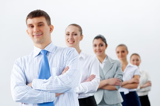 Group of businesspeople smiling standing with arms crossed