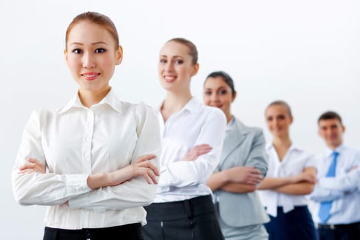 Group of businesspeople smiling standing with arms crossed