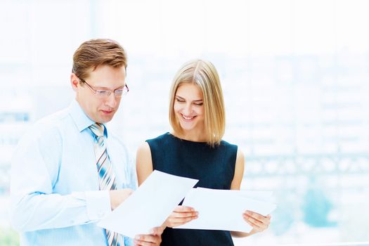 Two young business collegue working together in office