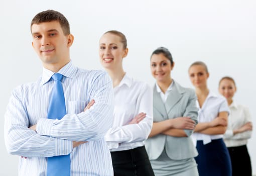Group of businesspeople smiling standing with arms crossed