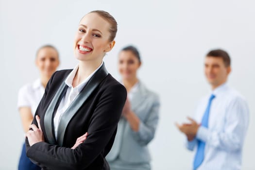 Image of four pretty young businesswomen standing in row