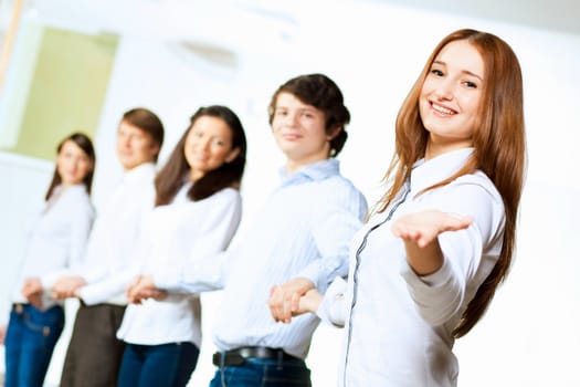 Image of five students in casual wear standing in row