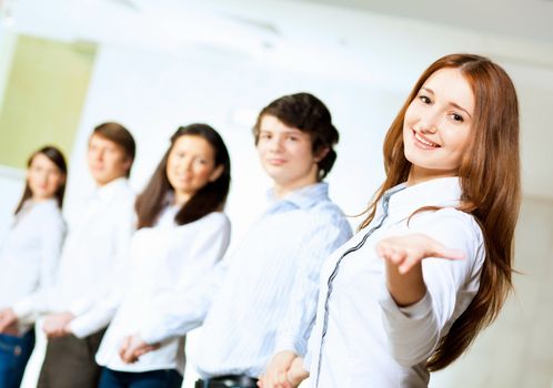 Image of five students in casual wear standing in row