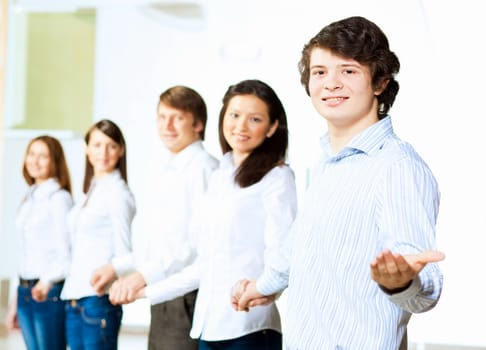 Image of five students in casual wear standing in row