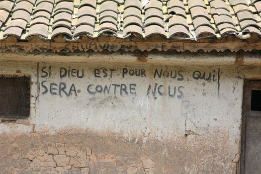 Mural on a village house in the Territory of Masisi, east of the Dr Congo. "Si Dieu est pour nous qui sera contre nous"