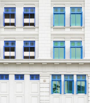 Retro windows with shutters in colonial architecture style building, Singapore
