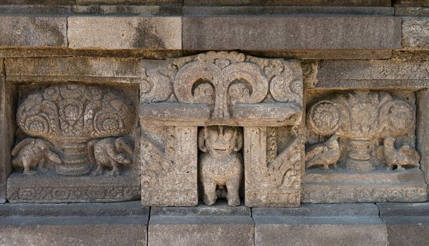 Prambanan panel, lion in niche flanked by two kalpataru trees each flanked by a pair of birds, Prambanan temple, Indonesia, Java, Yogyakarta