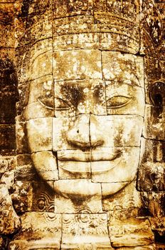 Detail of vintage stone face in the Bayon temple at Angkor Wat, Cambodia