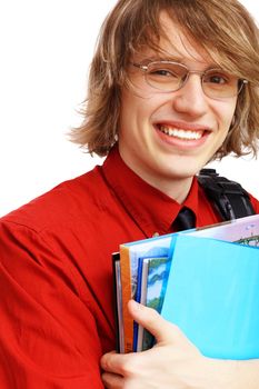 Happy smiling student standing and holding books