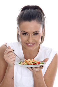 Model Released. Young Woman Eating Prawn and Noodle Salad