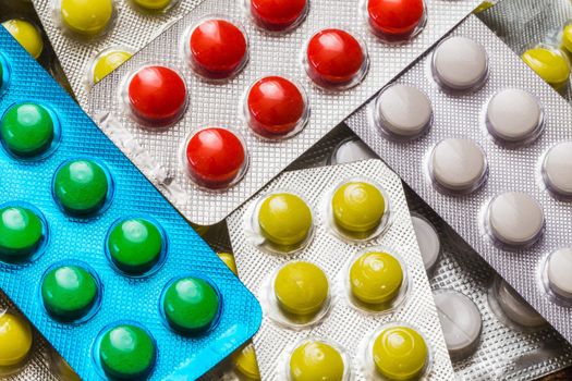 different colored pills in the pack closeup