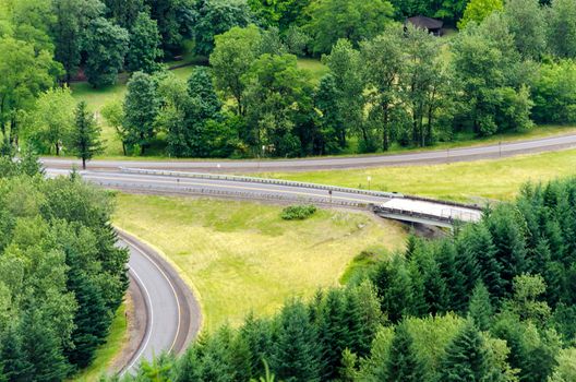 A highway interchange for I-84 surrounded by lush greenery