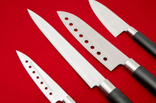 kitchen knives on a red background