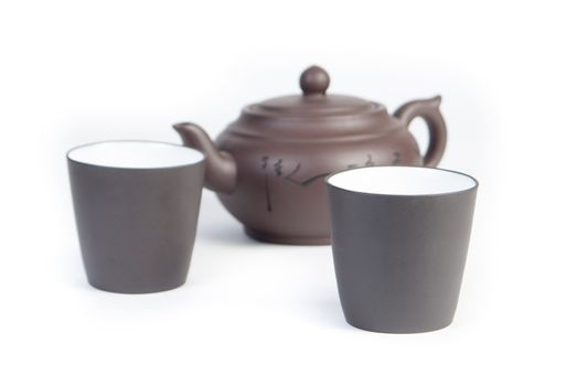 Chinese teapot with teacup on white background