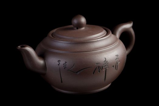 Chinese teapot on black background