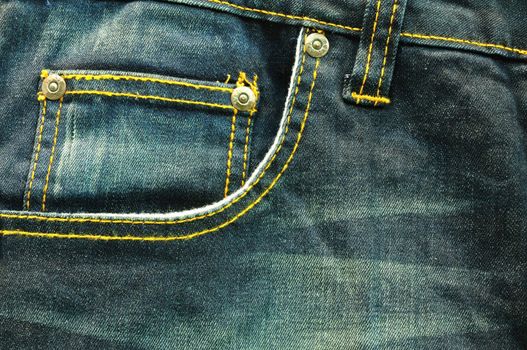 close up up of fancy washed blue jeans pocket 
