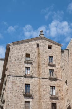 home with several balconies with sky background