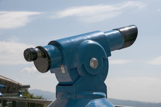 blue telescope to see the landscape