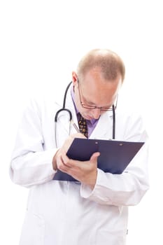 Male doctor making some important notes for diagnosis